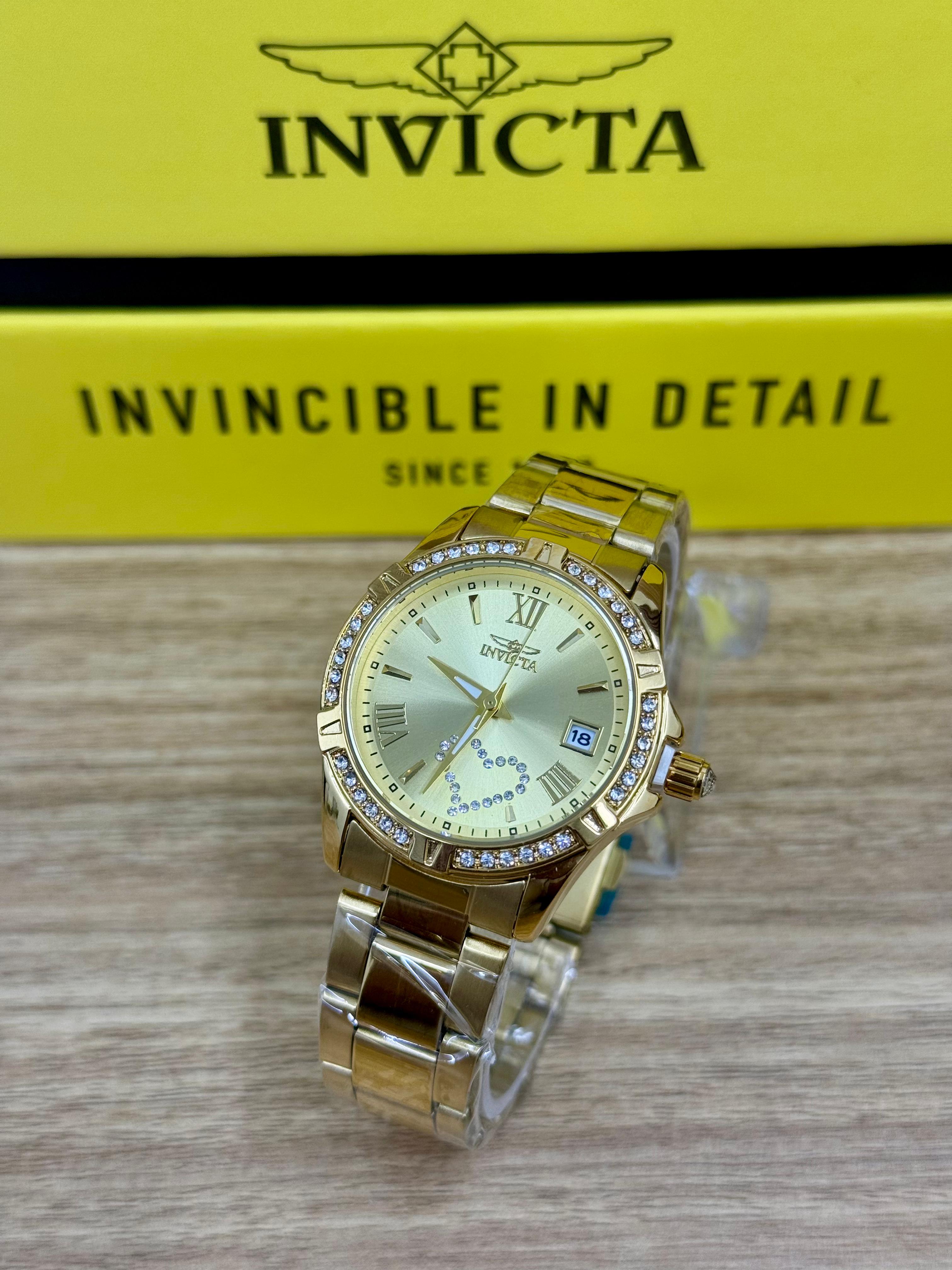 Invicta Mujer Metal Dorado